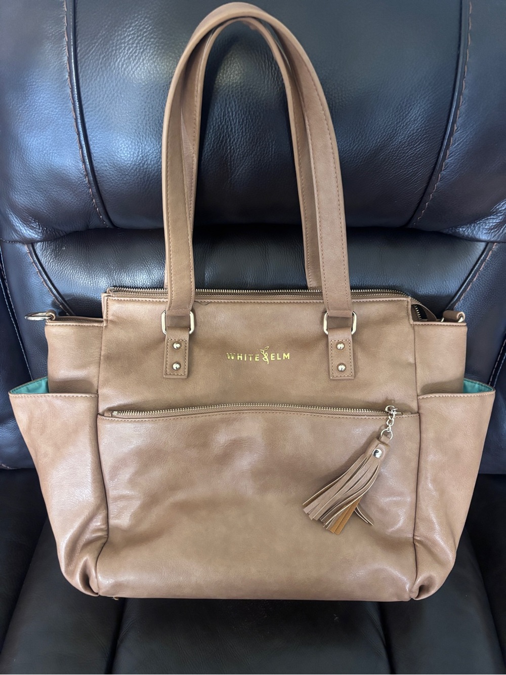 White Elm Gemini convertible tote/backpack. Almond with teal lining